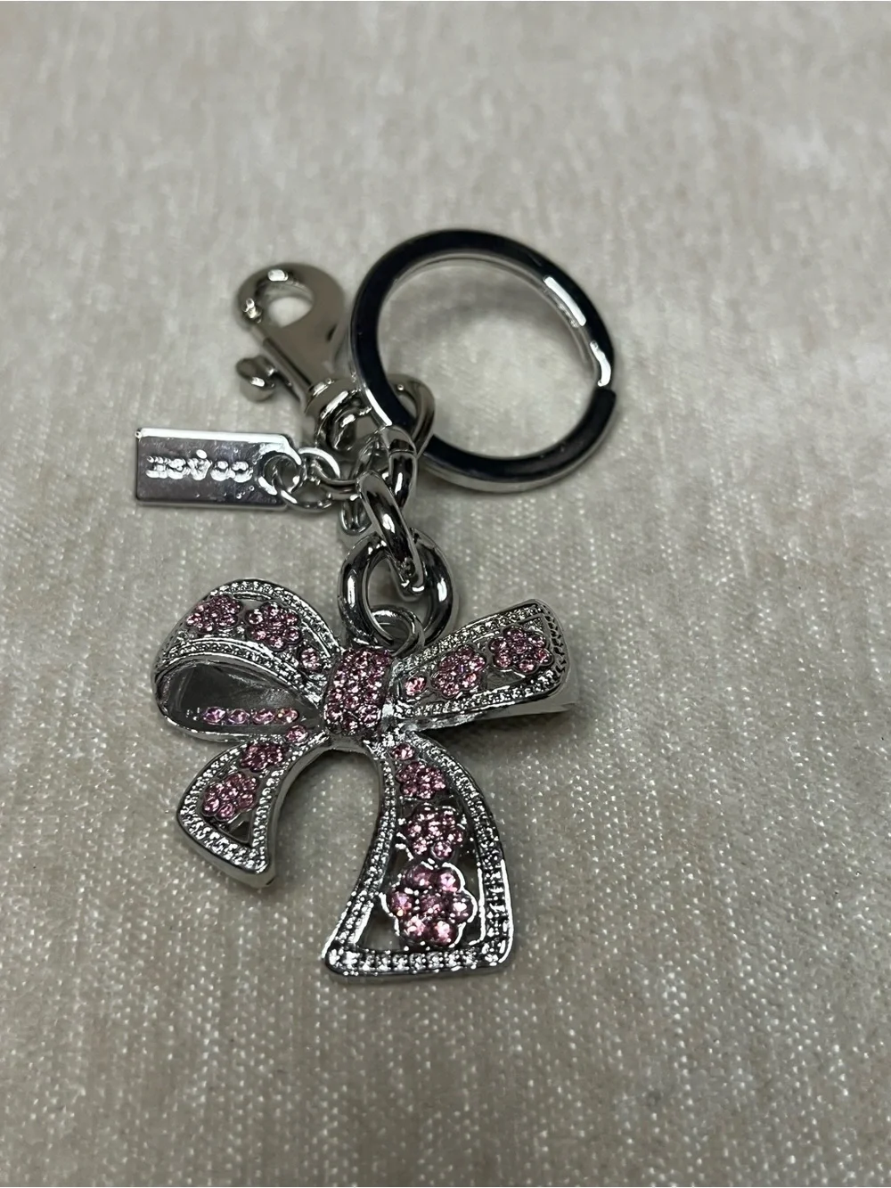 Coach Silver-Tone Pink Crystal Bow Key Ring Charm